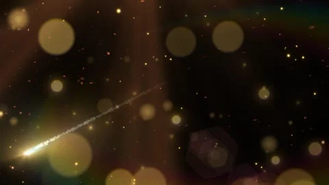 Golden meteor streaking through dark night sky surrounded by shimmering glowing Stock Footage 346121078