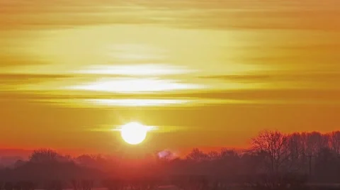 Golden morning sunrise over winter countryside landscape time lapse Stock Footage