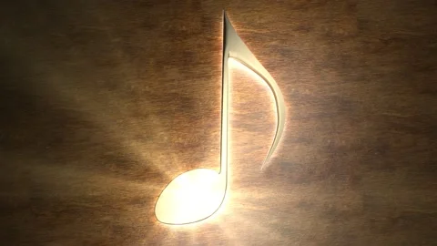 Golden musical note glows on the table. The magic of music. Note with rays of Stock Footage 133329395