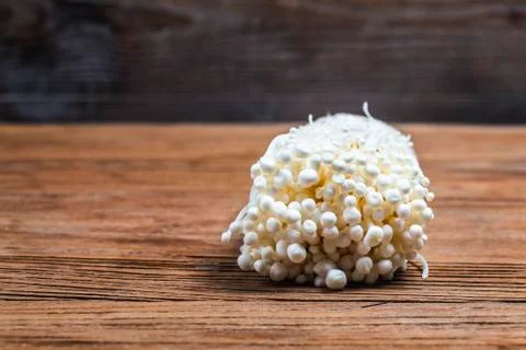Golden Needle Mushroom ?mushroom from the farm on wooden background Stock Photos