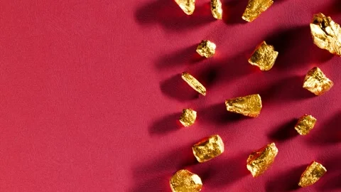Golden Nuggets on Red Background Stock Footage 288976445