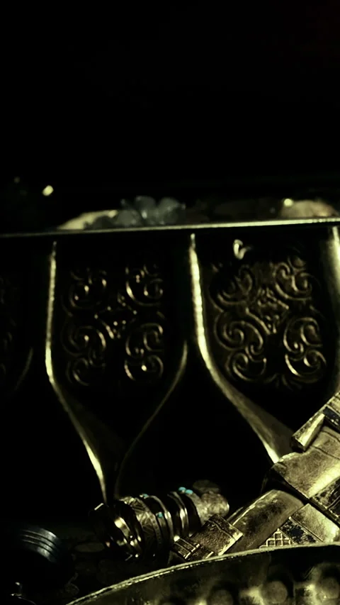 Golden objects with intricate patterns found in an old wooden box Stock Footage 334887188
