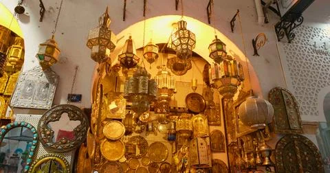 Golden objects trade handmade by local tunisian craftsmen in copper. Stock Photos