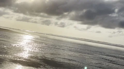 Golden Ocean Reflection with Dramatic Clouds Coastal Scene 4K Vídeo Stock 333783475