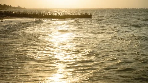 Golden Ocean Waves on Sandy Beach at Sunset or Sunrise Stockbeeldmateriaal 308670038