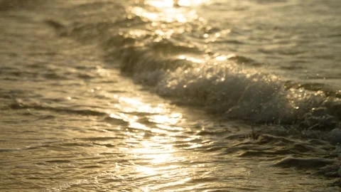 Golden Ocean Waves on Sandy Beach at Sunset or Sunrise Stockbeeldmateriaal 308670051