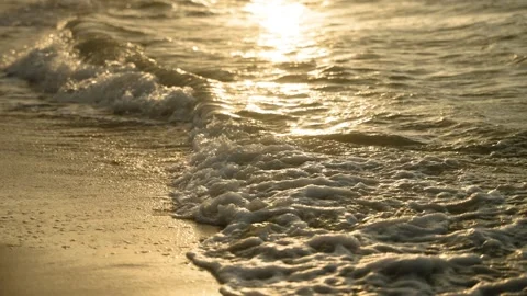 Golden Ocean Waves on Sandy Beach at Sunset or Sunrise Stockbeeldmateriaal 308670054