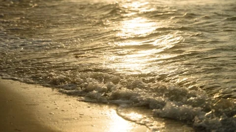 Golden Ocean Waves on Sandy Beach at Sunset or Sunrise Stock Footage 308670064