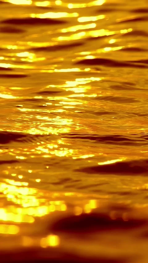 Golden ocean waves with sunset sun path reflection, sparkles and bokeh Stock Footage 336948518