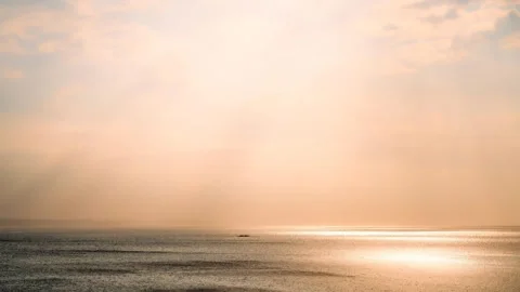 Golden ocean waves at sunset with warm light reflections, Atlantic coast, France 動画素材 333750641