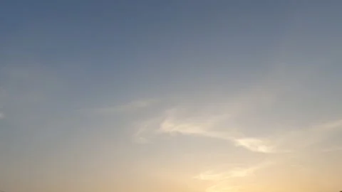 Golden orange yellow cloudscape on beautiful sunrise or sunset blue sky Stock Footage 147971978