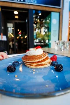 Golden pancake stack at a cafe table in Seville, Spain 库存照片