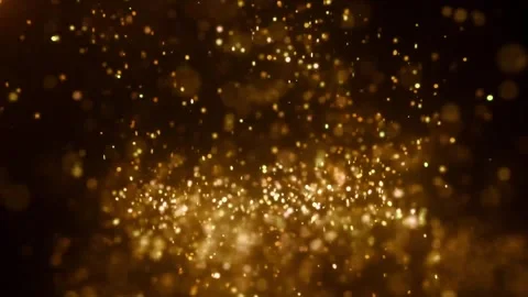 Golden particle explosion on black background. Abstract light dust burst with gl Stock Footage 340456551