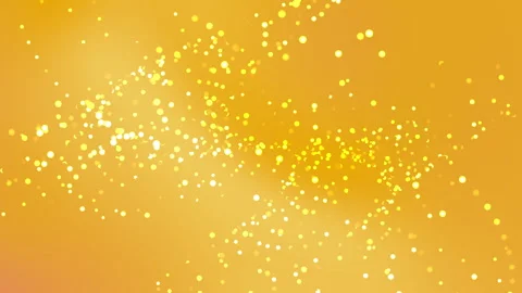 Golden particles drift through a warm, glowing backdrop Stock Footage 332613172