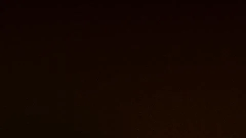 Golden particles falling and flickering on a dark background. Abstract, animated Stock Footage 278306881