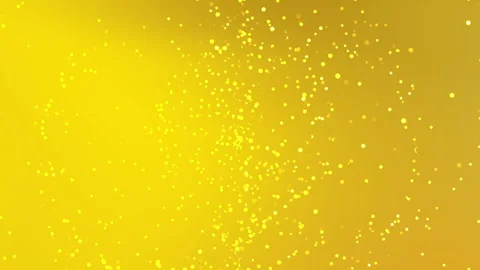 Golden particles float against a radiant yellow backdrop Stock Footage 332613166