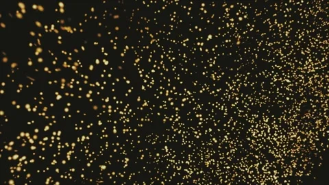 Golden particles float and shimmer against a dark backdrop Stock Footage 305769343