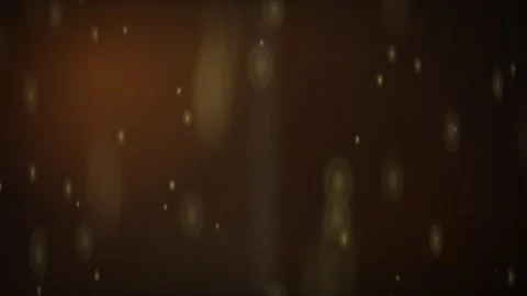 Golden particles floating on a dark brown abstract background Stock Footage 336994311