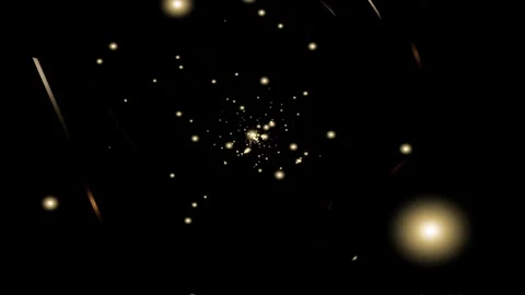 Golden particles floating in darkness with light streaks during festive cel.. Видео 347085594