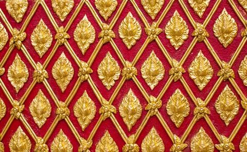 Golden pattern of thai art on wall temple Stock Photos