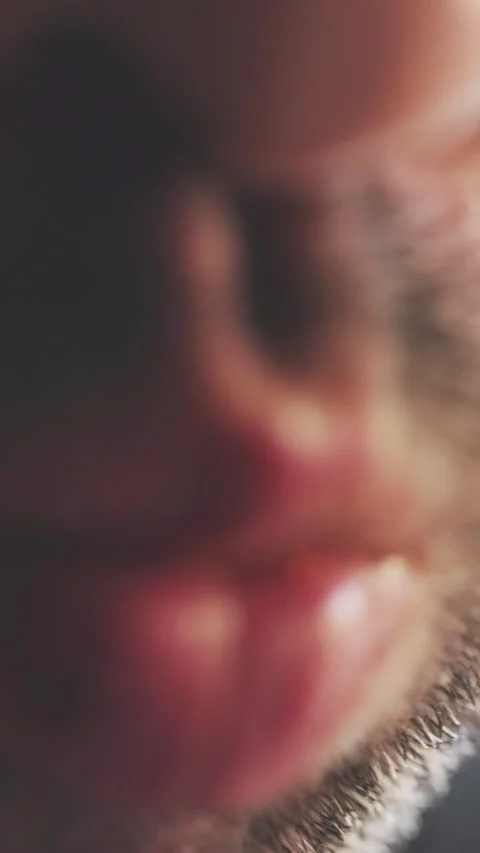 Golden Potato Chip Touching Lips Close-Up Crunchy Texture Stock Footage 316561173
