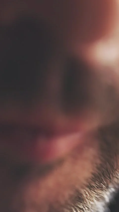 Golden Potato Chip Touching Lips Close-Up Crunchy Texture Stock Footage 316561176