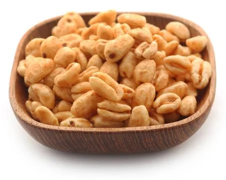 Golden puffed wheat Stock Photos