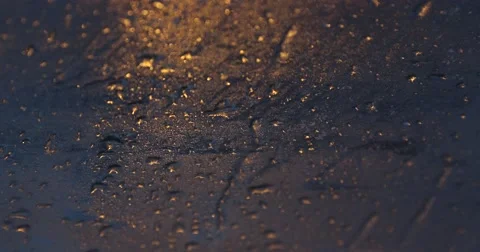Golden rain drops on stained car widshield Video stock 62801774