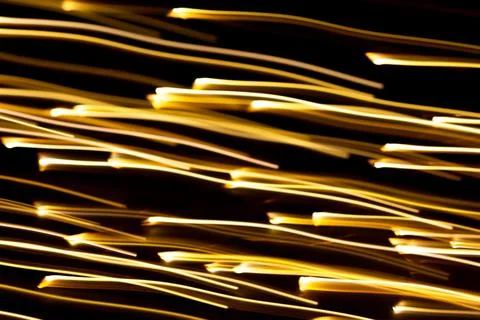 Golden rays of light go up or down. Motion effect, technology Stock Photos