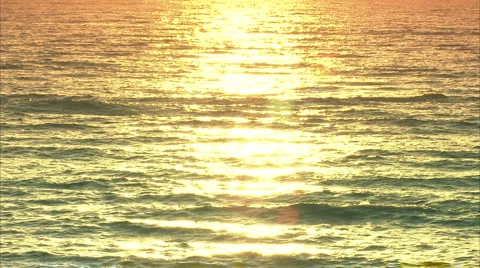 Golden rays reflect on water Video stock 986661