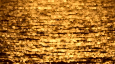 The golden rays of the sea surface at sunset Видео 117842210