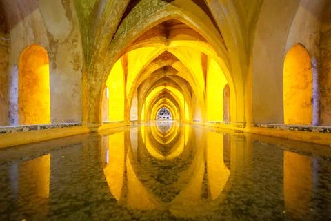 Golden Reflections The Baths of Mara de Padilla in Sevilles Alcazar, Spain Stock Photos