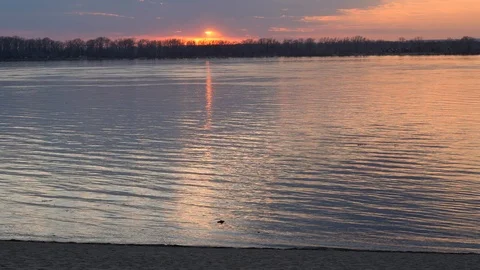 Golden reflections on the water from the last  Stock Footage 106974715