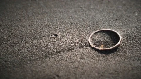 Golden ring on the beach in the sand Stock Footage 219223883