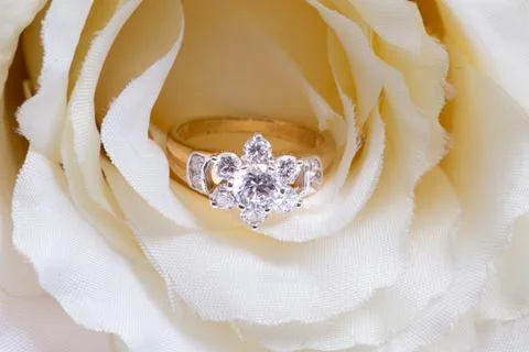 Golden ring with diamond. Stock Photos