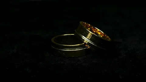 Golden Rings Rotating 360 Degrees on Black Background With Dim Light Stock-Footage 334448499