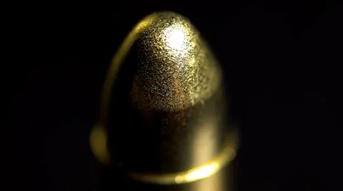 Golden round object on dark background Foto stock