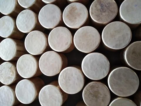 The golden round shape caps on the table Stock Photos