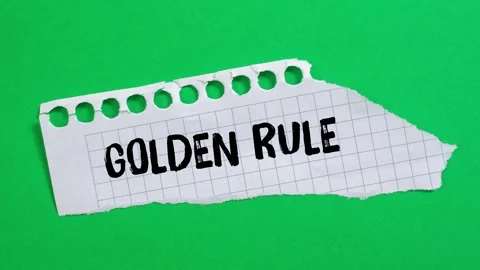 Golden rule message writing on ripped torn paper background Stock Footage 323585731