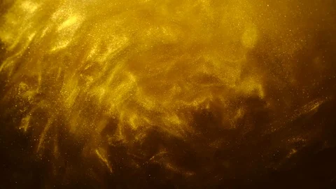 Golden sand or dust creating abstract cloud formations. Art backgrounds. Stock Footage 103635698