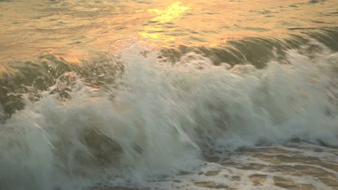 Golden sand with rolling waves at sunset 스톡 동영상 112952629