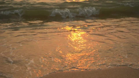 Golden sand with rolling waves at sunset Stock Footage 113416096