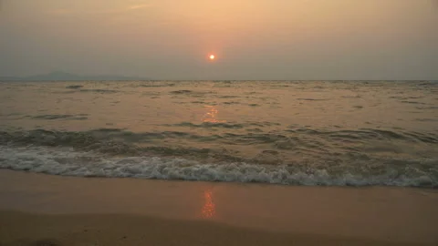 Golden sand with rolling waves at sunset Stock Footage 113416282