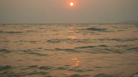 Golden sand with rolling waves at sunset Stock Footage 113416394