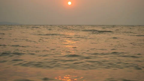 Golden sand with rolling waves at sunset Stock Footage 113416455