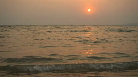 Golden sand with rolling waves at sunset Stock Footage 113416529