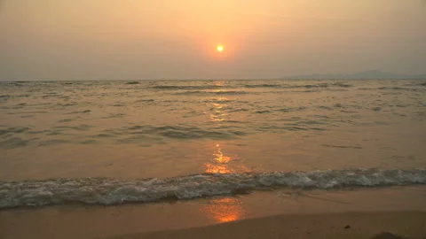 Golden sand with rolling waves at sunset Stock Footage 113416616