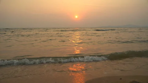 Golden sand with rolling waves at sunset Stock Footage 113416707