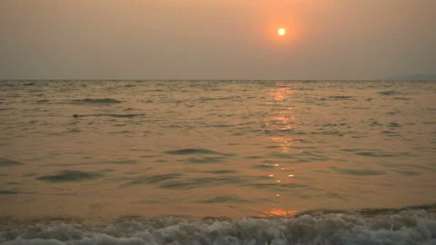 Golden sand with rolling waves at sunset Stock Footage 113416716
