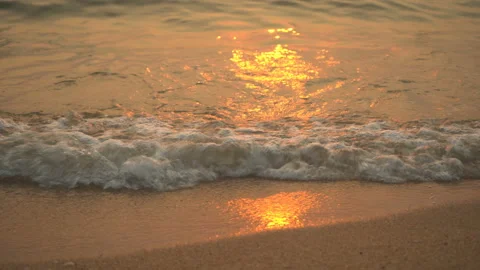 Golden sand with rolling waves at sunset Stock Footage 113417049